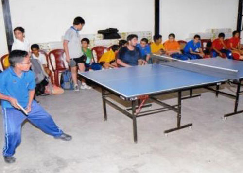 Students having a competitive session during a Table Tennis and Badminton practice in Indoor Sports Complex.